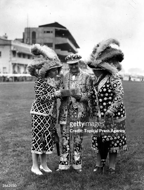 The Marriots, pearly king and queen of Finsbury, with their daughter Princess Maria at the Epsom Derby.