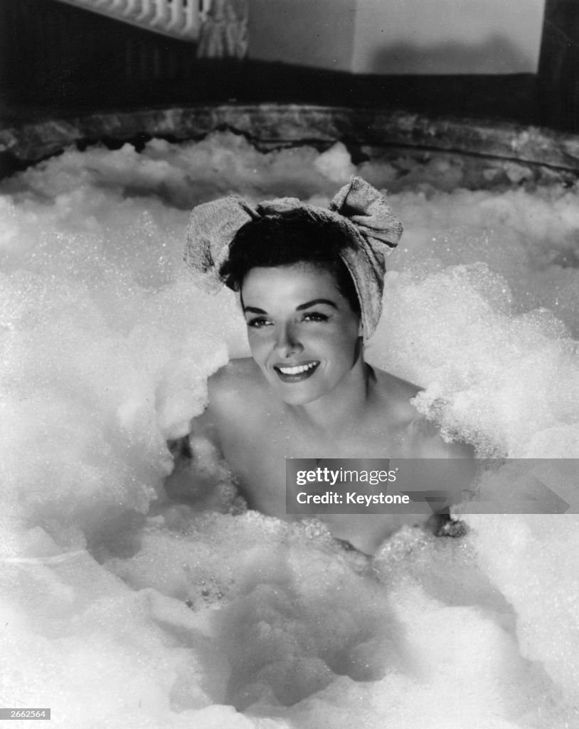 Jane Russell R American actress Jane Russell enjoys a bubble bath in a scene from ...