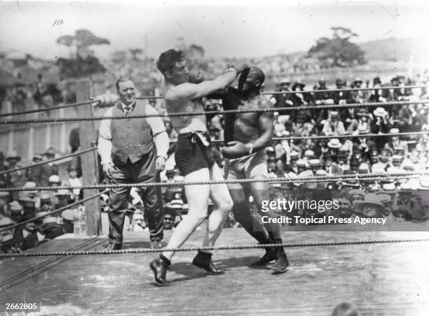 Jack Johnson, right, of the USA, world heavyweight title holder since 1908, in action against Jess Willard of the USA at Havana, Cuba in 1915....