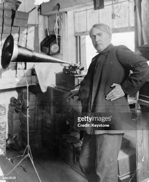 American inventor and businessman Thomas Edison with an Edison Standard Phonograph, at his lab in West Orange, New Jersey, 1906. The Edison Standard...
