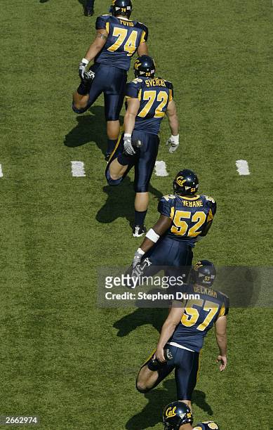 The California Golden Bears warm up prior to their game against the USC Trojans at Memorial Stadium on September 27, 2003 in Berkeley, California....