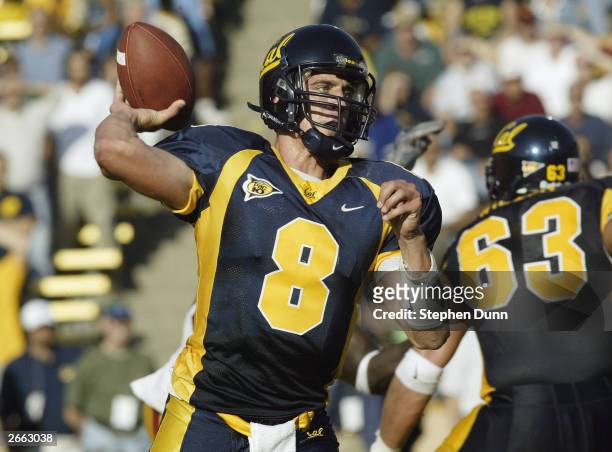 Quarterback Aaron Rodgers of the California Golden Bears makes the pass during the game against the USC Trojans at Memorial Stadium on September 27,...