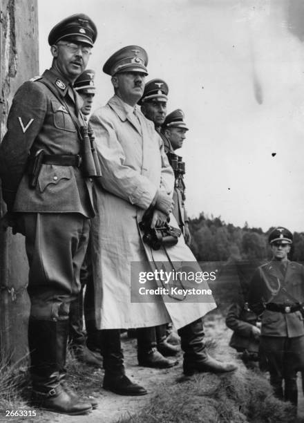 German dictator Adolf Hitler and German Nazi leader and chief of police Heinrich Himmler watching Stormtroop manoeuvres.