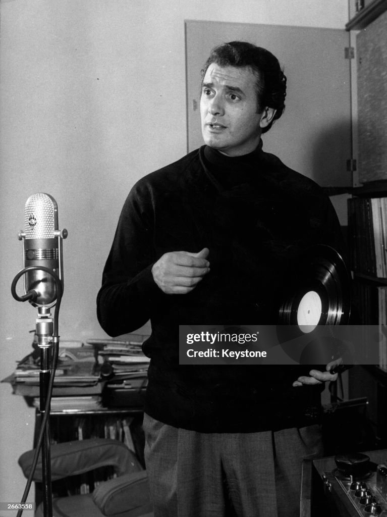 Stephen Corelli Italian opera singer Franco Corelli holding a record in front of an ...
