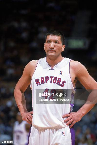 Mengke Mengke Bateer of the Toronto Raptors stands on the court during the ...