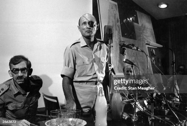 Israeli soldier, statesman, and Minister of Defence, General Moshe Dayan holds a press conference in Jerusalem during the Six Day War. Original...
