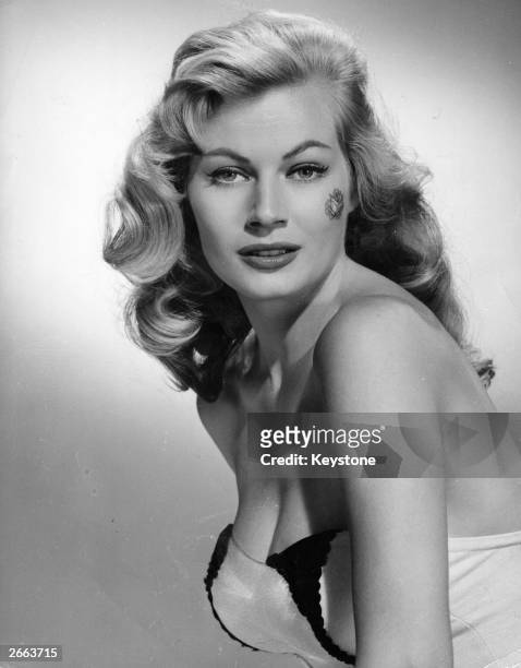 The Swedish actress Anita Ekberg, known as 'The Iceberg', wearing the latest Hollywood craze - a rose on the cheek. The Hollywood film 'The Rose...