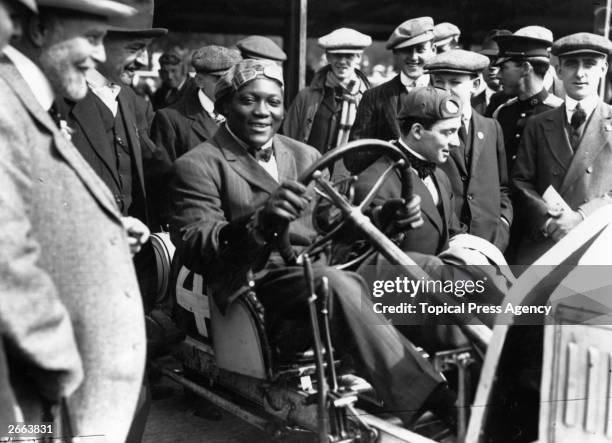 Jack Johnson of the USA, one of the greatest yet most unpopular Heavyweight boxers of all time. In 1908 he took the world title from Tommy Burns and...