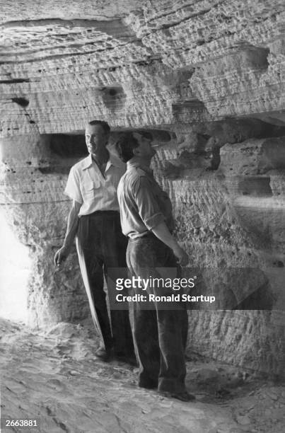 British archaeologist Lankester Harding in the caves on the north-west shores of the Dead Sea, Jordan, where Jewish holy scrolls, identified as...