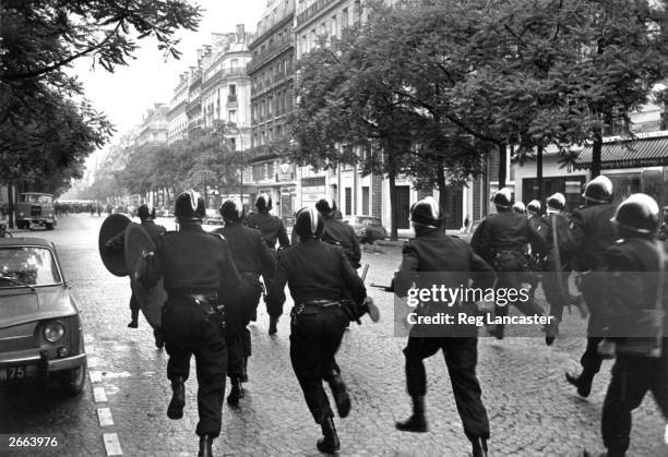 French riot police, the CRS clear the streets of Paris during the student riots.