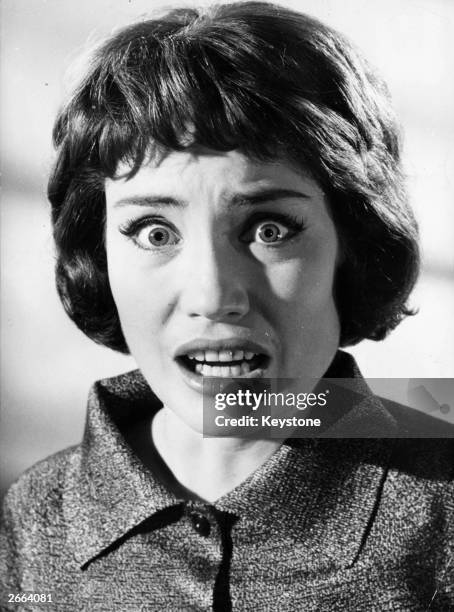 German actress Ellen Schwiers plays the murderer's victim in the film 'Mann Im Schatten', directed by Arthur Maria Rabenalt.