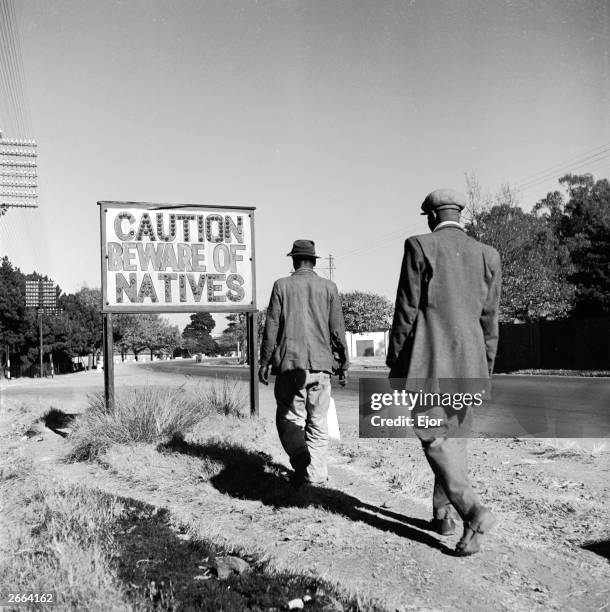 Sign common in Johannesburg, South Africa, reading 'Caution Beware Of Natives'.