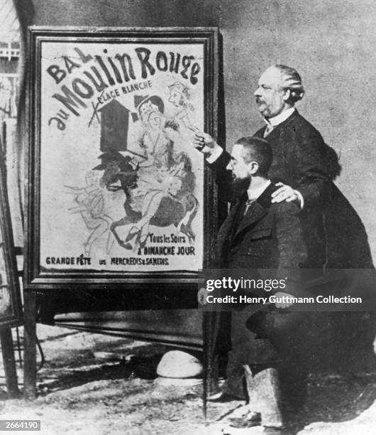 French painter Henri Toulouse-Lautrec standing with the Director of the Moulin Rouge, Tremolada by one of his painted posters advertising the famous...
