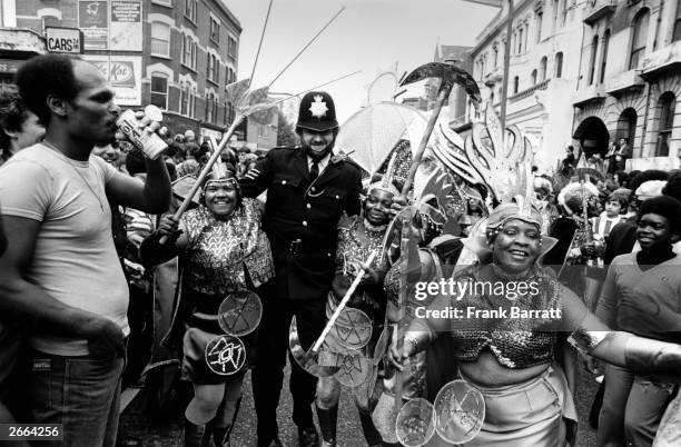Policeman joining in with the festivities at the Notting Hill Carnival in west London.