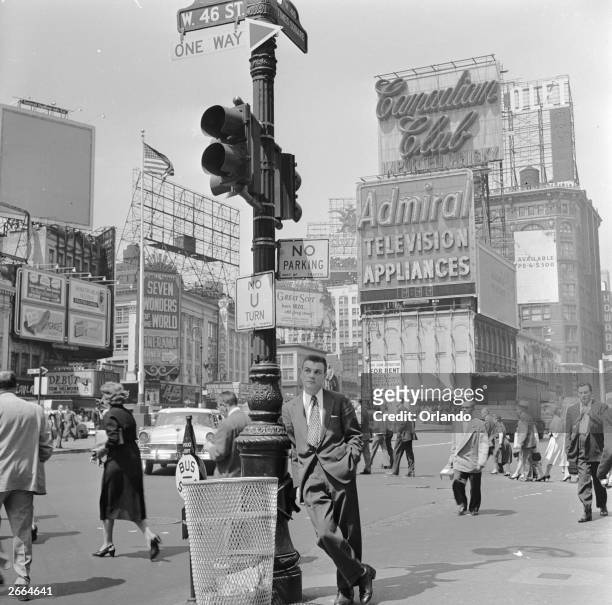 Salesman bides his time in Times Square, Manhattan, New York.