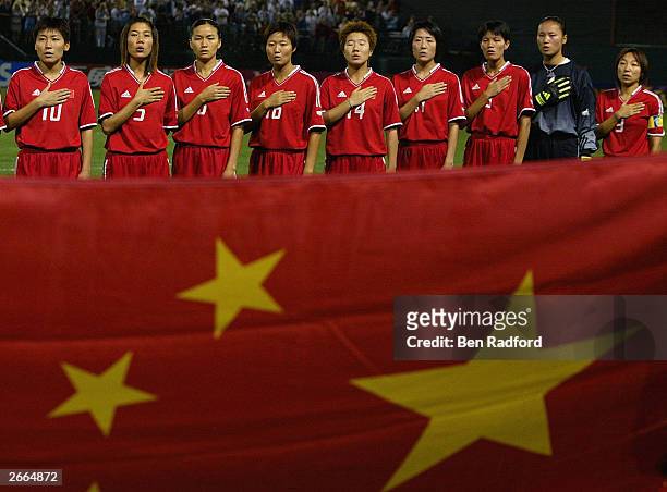 China's national team salutes the flag before the match against Russia in the first round of the FIFA Women's World Cup at the PGE Park on September...