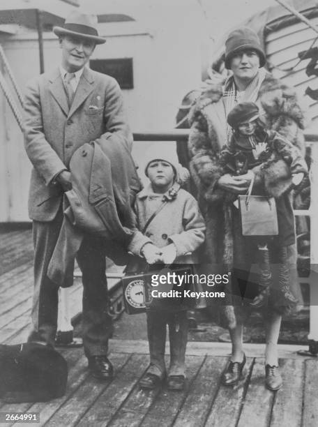 American novelist F Scott Fitzgerald with his wife, Zelda, and daughter on a liner's deck.