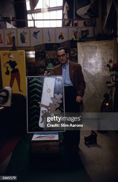 American painter and photographer Man Ray at his Left Bank studio in Paris.