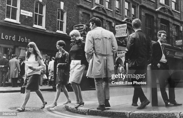 Young shoppers walking along Carnaby Street, Central London.