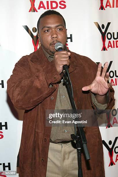 Rapper Timbaland gestures as he speaks at a a media conference for the "YouthAIDS Annual Benefit Gala 2003" at Capitale October 27, 2003 in New York...