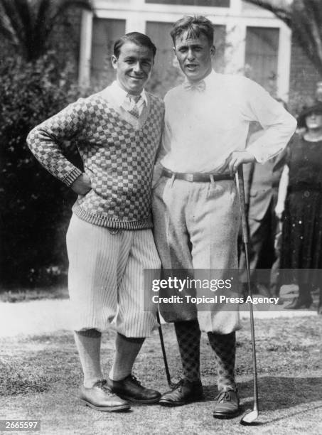 Winner of the National Championship Golf Cup, Bobby Jones who won the British Open three times and the US Open four times on the right with fellow...