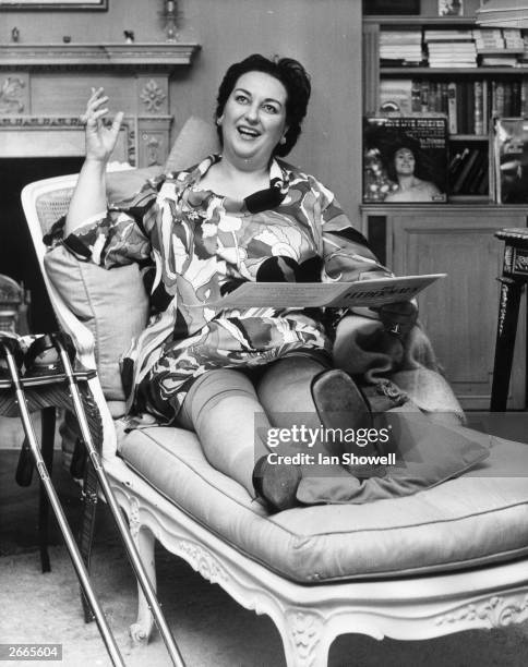 Opera singer Montserrat Caballe relaxes on a settee with her injured leg still bandaged after she broke it in a fall. She is in London to sing the...