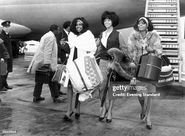 American Motown band The Supremes, left to right, Mary Wilson, Florence Ballard and Diana Ross arrive at London's Heathrow Airport.