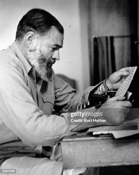 Novelist, short-story writer and war correspondent Ernest Hemingway . Original Publication: Picture Post - 1748 - Hemingway Looks At The War In...