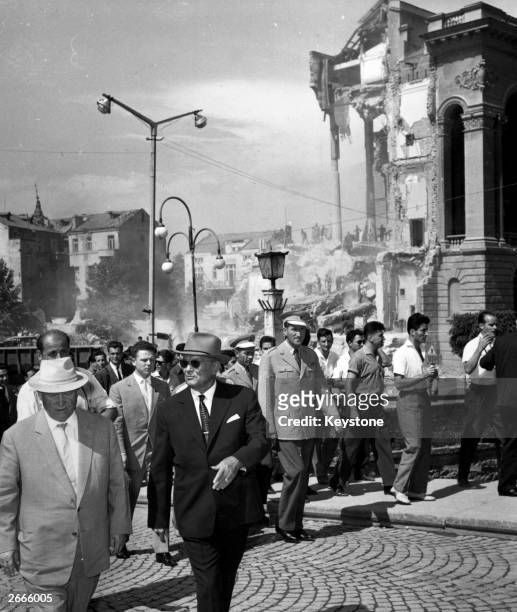 Soviet premier Nikita Khrushchev and Yugoslavian president Josip Broz Tito in front of the shattered Army Club in Skopje, Yugoslavia, during their...