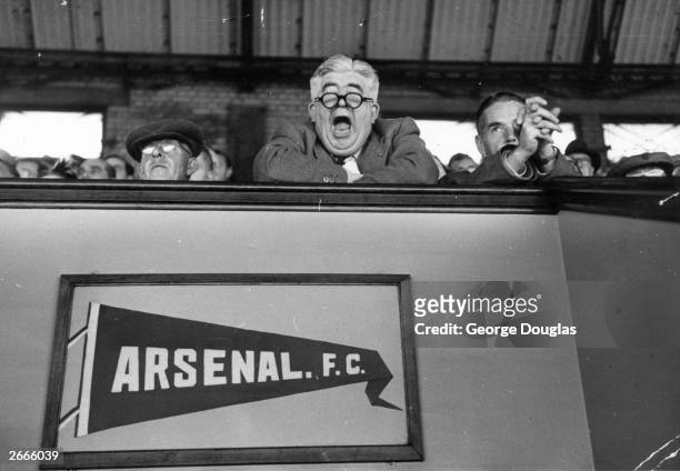 An Arsenal supporter yawns during a match between Arsenal and Glasgow Rangers at Arsenal's Highbury Stadium, London. Original Publication: Picture...