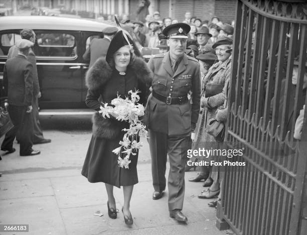 Lord Digby escorts his daughter, Pamela to St John's Church, Westminster, London, for her wedding to Randolph Churchill, the Conservative politician...