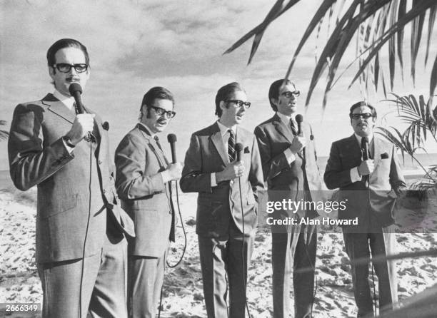 The Monty Python team imitate journalist and broadcaster Alan Whicker. Left to right: John Cleese, Michael Palin, Eric Idle, Graham Chapman and Terry...