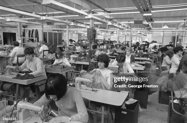 Women machining garments at Lea Mills, Matlock, Derbyshire. Founded in 1784 by Thomas Smedley the mills have been modernised by the present company,...