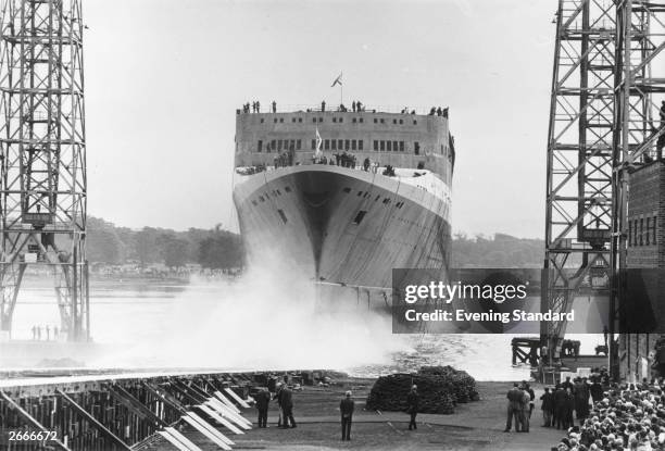 Liner QE2 taking to the water at Clydebank after being named by Queen Elizabeth II.