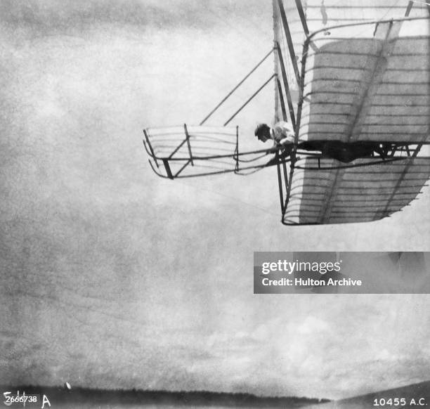 Wilbur Wright flying a 'Wright No 1' glider at Kill Devil Hills, near Kitty Hawk, North Carolina.