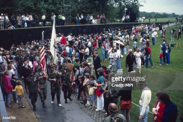 Crowds watching the dedication ceremony at the Vietnam Memorial in Washington DC, 13th November 1982.