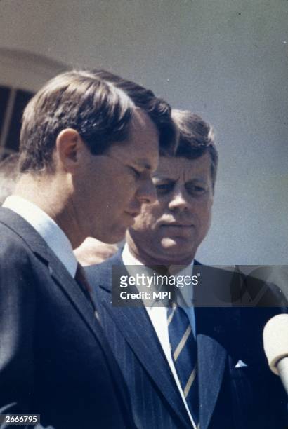 American President John F Kennedy with his brother, the Attorney General Robert Kennedy .