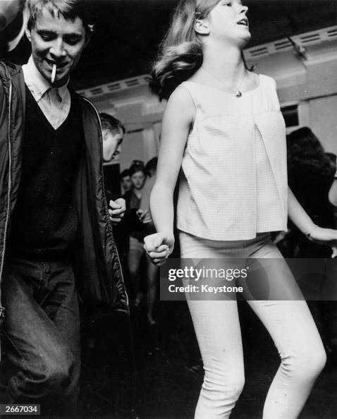 Teenagers wearing typical 'Mod' clothing, including the classic parka ...