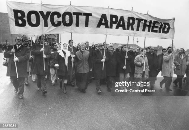 Anti-apartheid marchers, including David Sheppard, Bishop of Woolwich and Anne Kerr MP, Methodist preacher and christian socialist Lord Donald Soper...