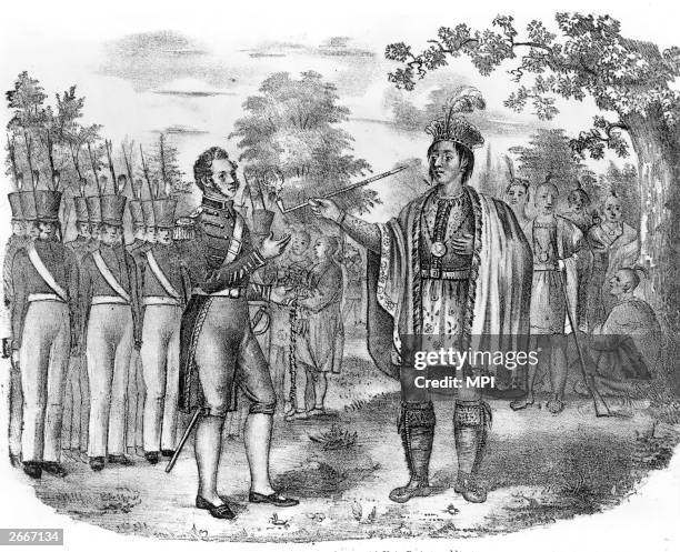 Pontiac , chief of the Ottawa tribe and leader of a federation of Native Americans against the settlers smokes the peace pipe at a meeting with Major...