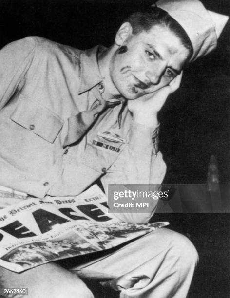 An American soldier with lipstick on his face after VJ day celebrations.