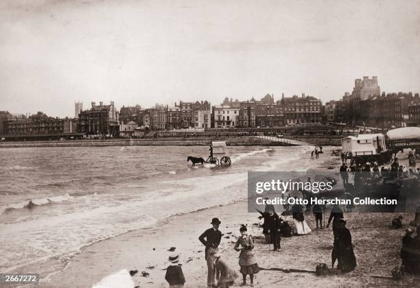 Victorian daytrippers on the beach at Margate in Kent.