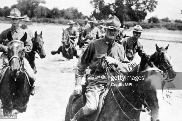 General John Pershing leading American troops in pursuit of Mexican bandits led by Pancho Villa.