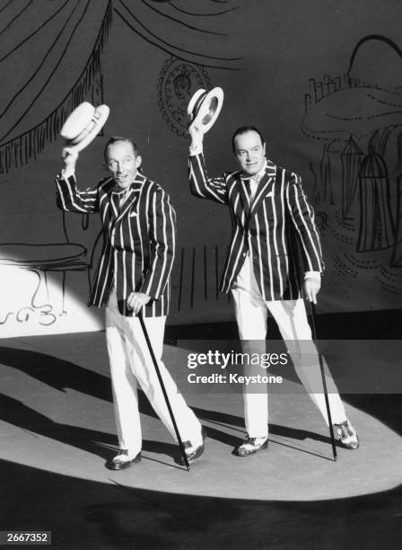 American singer Bing Crosby and comic actor Bob Hope on the film set of 'The Road to Hong Kong' at Shepperton Studios, England.