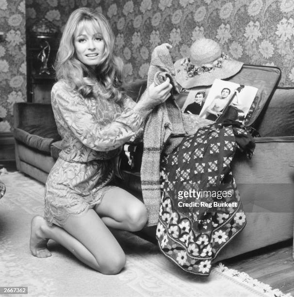 English actress Suzy Kendall packing her suitcase for a film location trip to Miami.