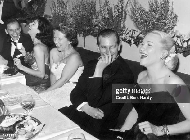 Left to right, Frank Sinatra, Ava Gardner , Mrs C.J. Latta, Prince Philip, Duke of Edinburgh and American opera singer Dorothy Kirsten enjoying an...