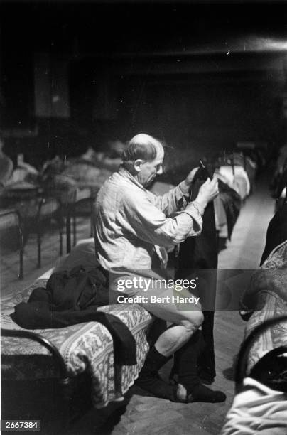 Homeless man staying in a Salvation Army hostel in the Elephant And Castle, London, with 470 men like him. Original Publication: Picture Post - 4694...