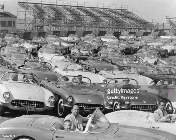 Rally of car enthusiasts in New York all driving 1950's Corvette Convertible Stingrays made by Chevrolet.