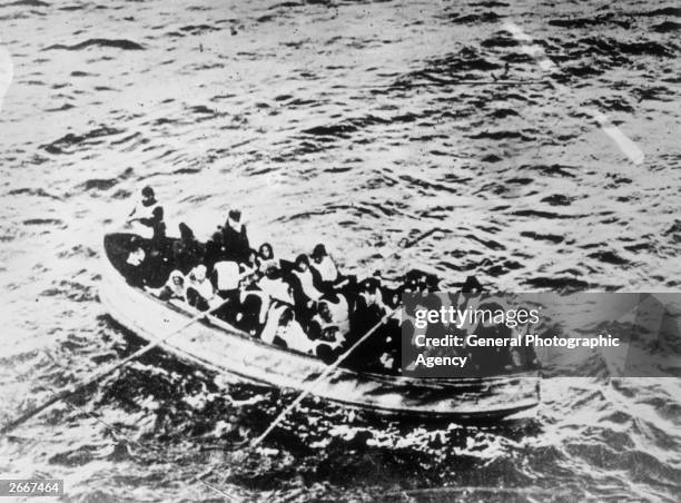 Survivors of the 'Titanic' disaster in a crowded lifeboat.