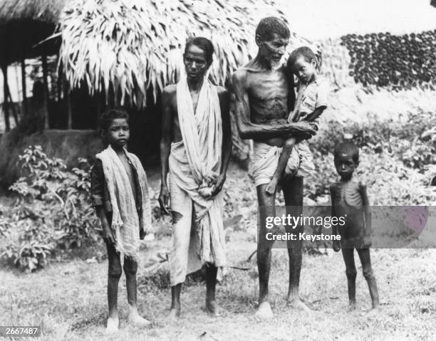 Family of semi-starved Indians who have arrived in Calcutta in search of food.